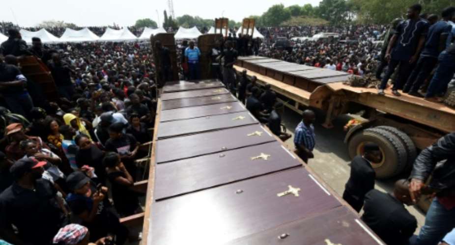 Coffins arrive at Ibrahim Babanginda Square in the Benue State capital Makurdi, on January 11, 2018, during a funeral service for scores who died following clashes between Fulani herdsmen and natives of Guma and Logo districts.  By PIUS UTOMI EKPEI AFPFile