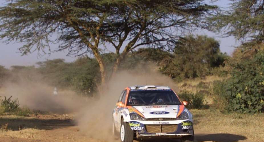 Colin McRae on his way to victory in the last leg of the last Safari Rally in 2002.  By SIMON MAINA AFPFile