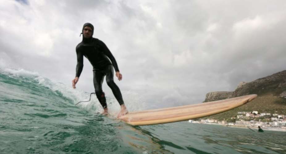 Comeback: Wooden surfboards became sidelined by synthetic materials. Green awareness has put them in the spotlight..  By ANTOINE DEMAISON AFP