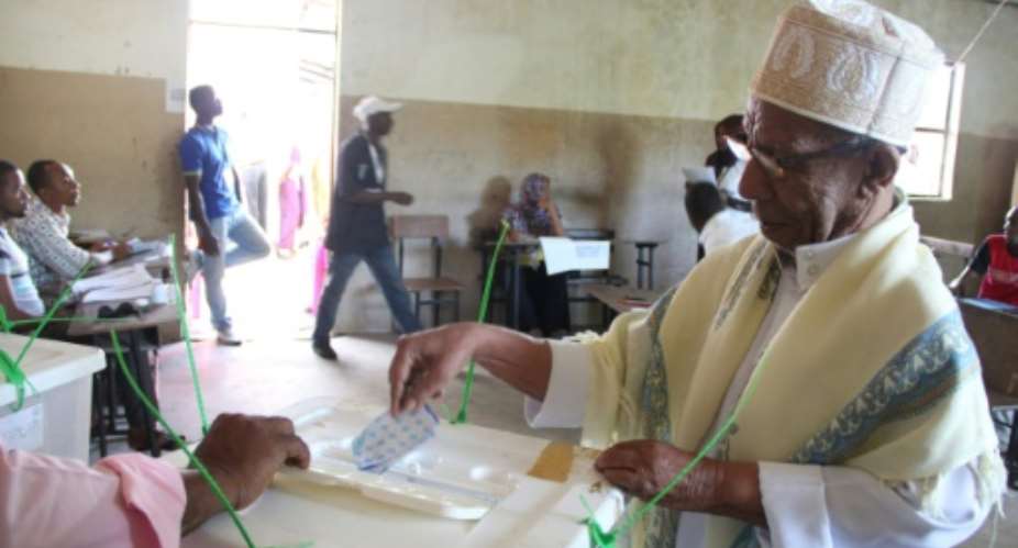 A man casts his ballot in Moroni during the second round of presidential elections in Comoros.  By Ibrahim Youssouf AFP