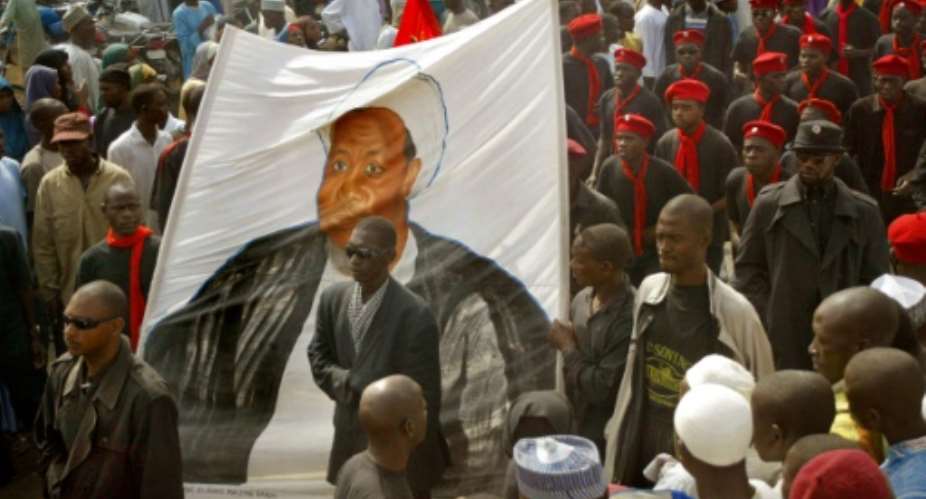 A series of demonstrations were staged win various parts of northern Nigeria, calling for the release of Ibrahim Zakzaky, depicted here on a banner in Kano, who was detained following a military crackdown on his followers.  By Pius Utomi Ekpei AFPFile