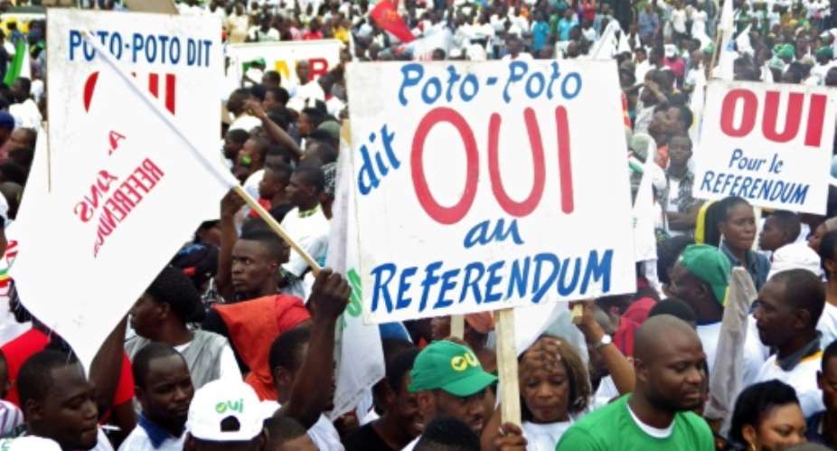 Supporters of Congolese President Denis Sassou Nguesso rally in Brazzaville to back the presidents controversial bid to change the constitution in order to remain in power, on October 10, 2015.  By Laudes Martial Mbon (AFP/File)