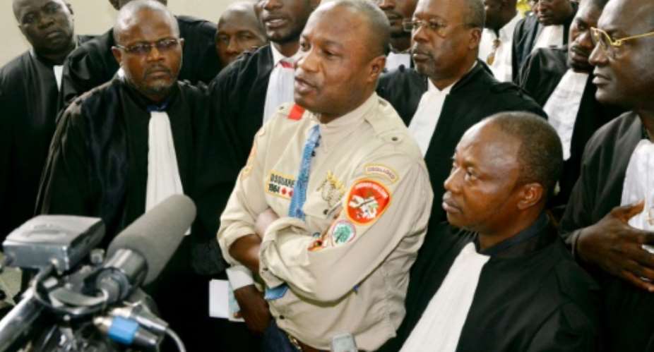 Congolese singer Koffi Olomide C listens to the verdict on August 16, 2012 at the court in Kinshasa. Olmide got a three-month suspended sentence in a trial on charges of  'hitting and injuring' a Congolese producer.  By Junior Khanna AFPFile