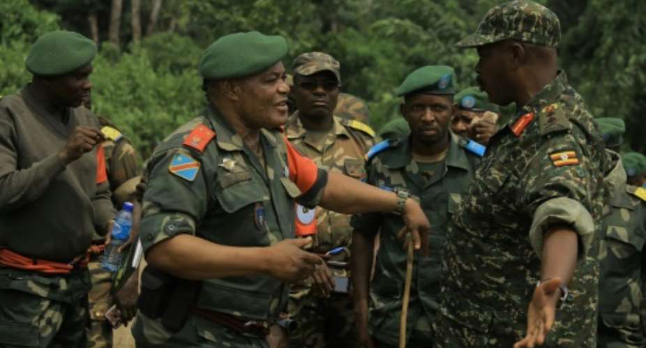 Congolese General Camille Bombele, left, and Ugandan Major General Kayanja Muhanga, at a camp in Semulki last December.  By SÃ©bastien KITSA MUSAYI (AFP)
