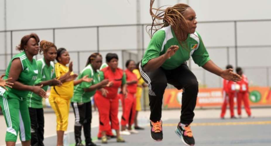 Congolese athletes compete in the game of Nzango at the 11th African Games in Brazzaville.  By Monirul Bhuiyan (AFP)