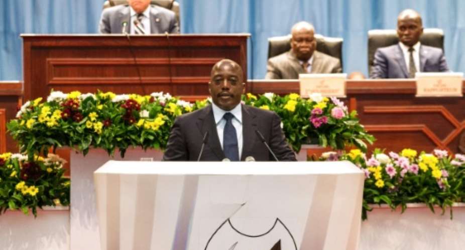 Congolese President Joseph Kabila C speaks during a special joint session of parliament on November 15, 2016 in Kinshasa.  By Junior D. Kannah AFP