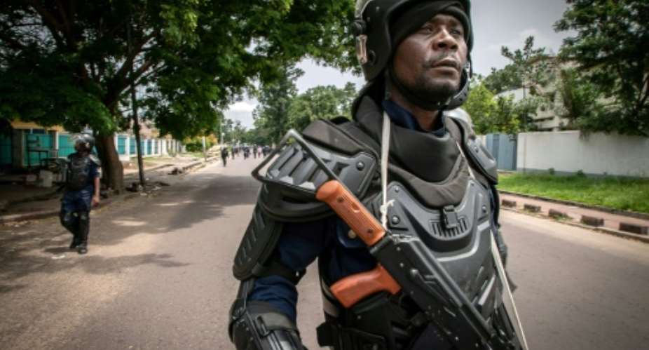 Congolese riot police have been deployed around the courthouse building.  By CAROLINE THIRION AFP