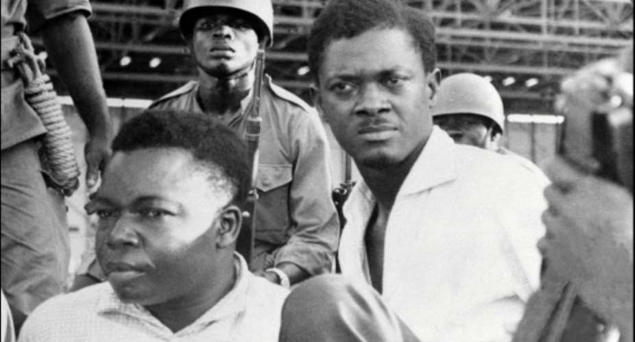 Congolese soldiers guard Patrice Lumumba r upon his arrest in November 1960.  By - AFPFile