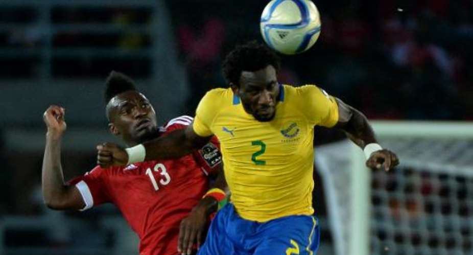 Congo forward Thievy Bifouma L challenges Gabon defender Aaron Appindangoye during the 2015 Africa Cup of Nations group A match in Bata on January 21, 2015.  By Khaled Desouki AFPFile