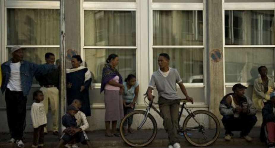 People wait outside of the general hospital in Madagascar's capital Antananarivo in 2009.  By Walter Astrada AFPFile