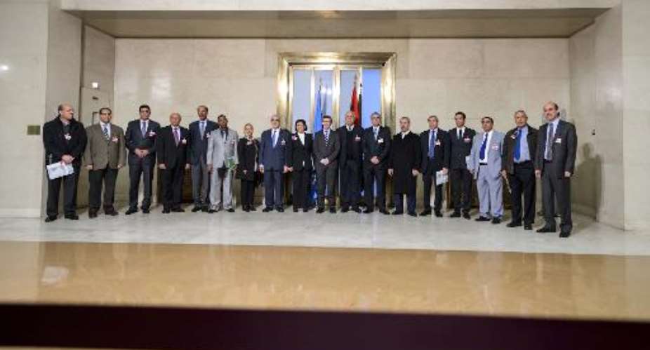 United Nations UN special envoy for Libya Bernardino Leon 10th L pose for a photo with Libya's warring factions representatives prior to talks on January 14, 2015 in Geneva.  By Fabrice Coffrini AFPFile