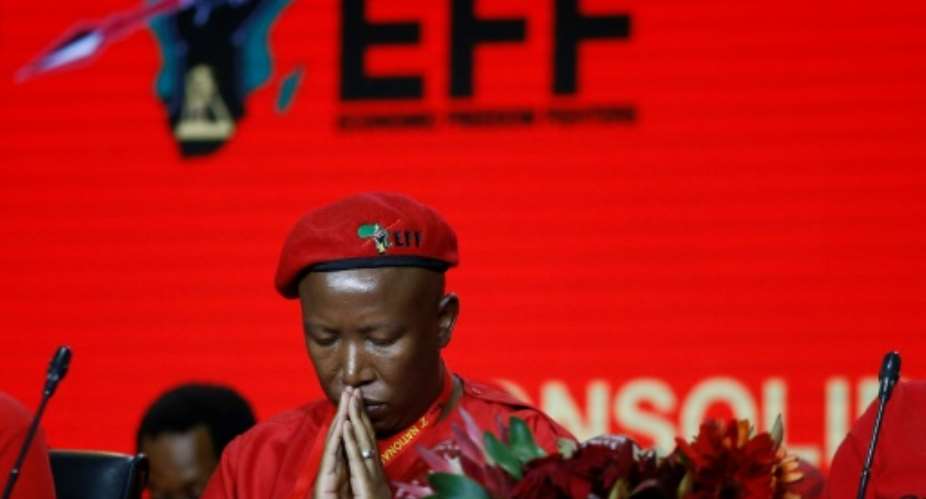 Controversial former ANC youth head Julius Malema was re-elected as head of the Economic Freedom Fighters -- but a decision to bar some local media caused a rumpus.  By Phill Magakoe AFP