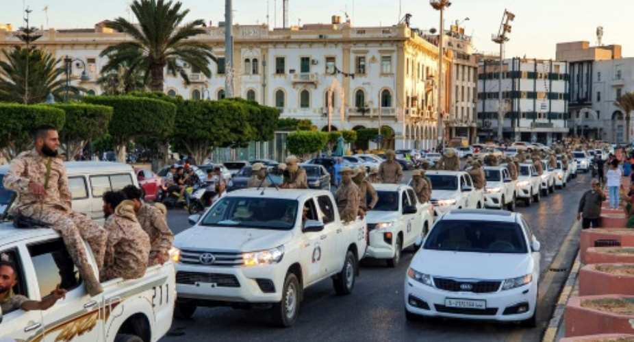 Convoy of the Tripoli Brigade, a militia loyal to the UN-recognised Government of National Accord GNA, parade through Martyrs' Square at the centre of the GNA-held Libyan capital Tripoli.  By Mahmud TURKIA AFP