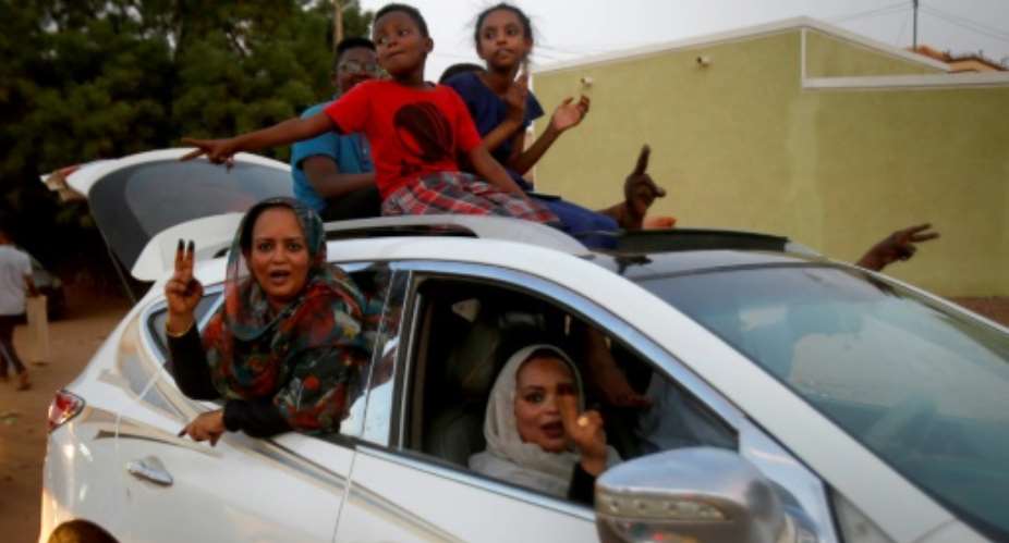 Convoys of vehicles honking horns took to the streets of Khartoum as Sudanese celebrated a hard-won deal between protest leaders and the ruling generals aimed at drawing the line under months of political unrest.  By ASHRAF SHAZLY AFP