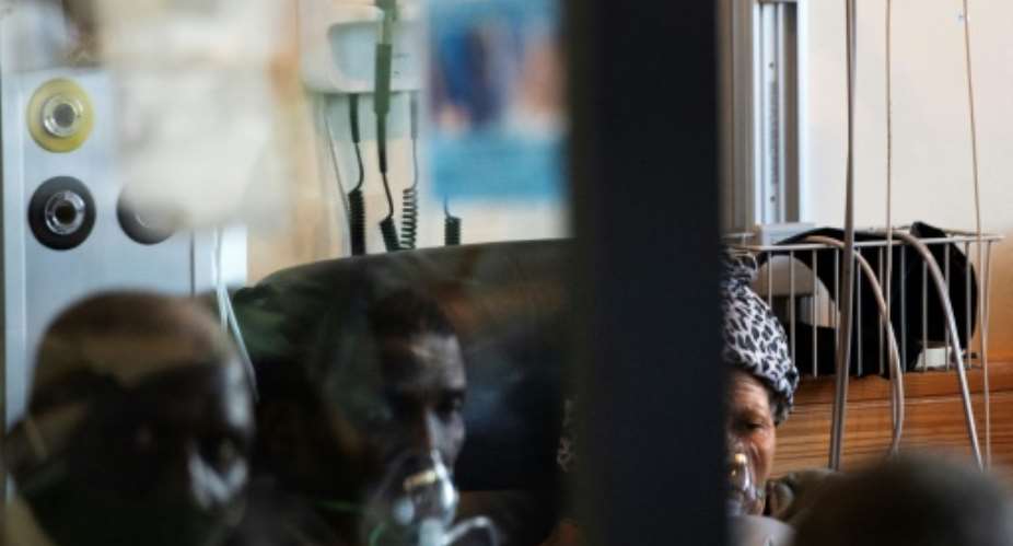 Coronavirus patients get oxygen at Khayelitsha Hospital, near Cape Town.  By RODGER BOSCH AFP