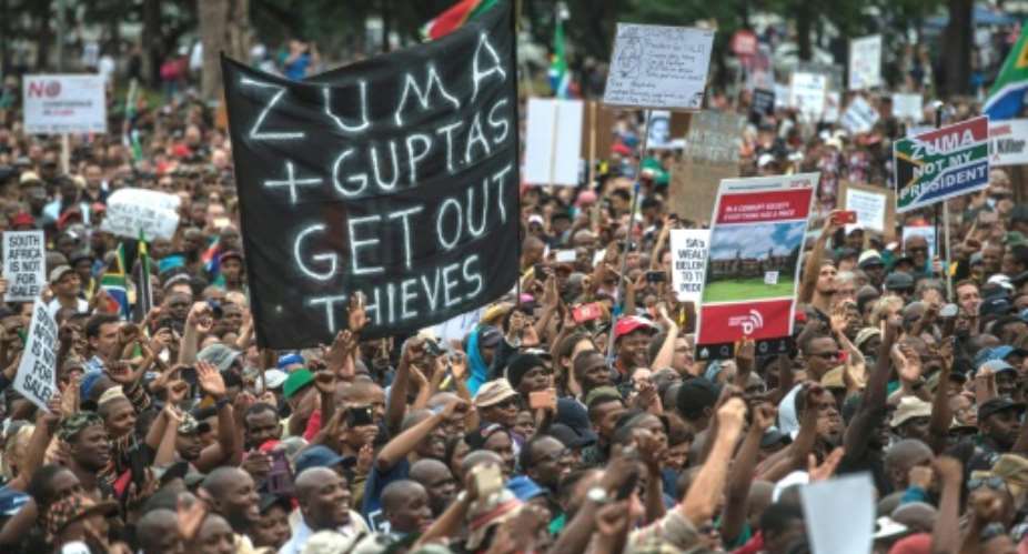 Corruption scandals linked to the Gupta brothers sparked mass protests, culminating in President Jacob Zuma's ouster in 2018.  By MUJAHID SAFODIEN AFP