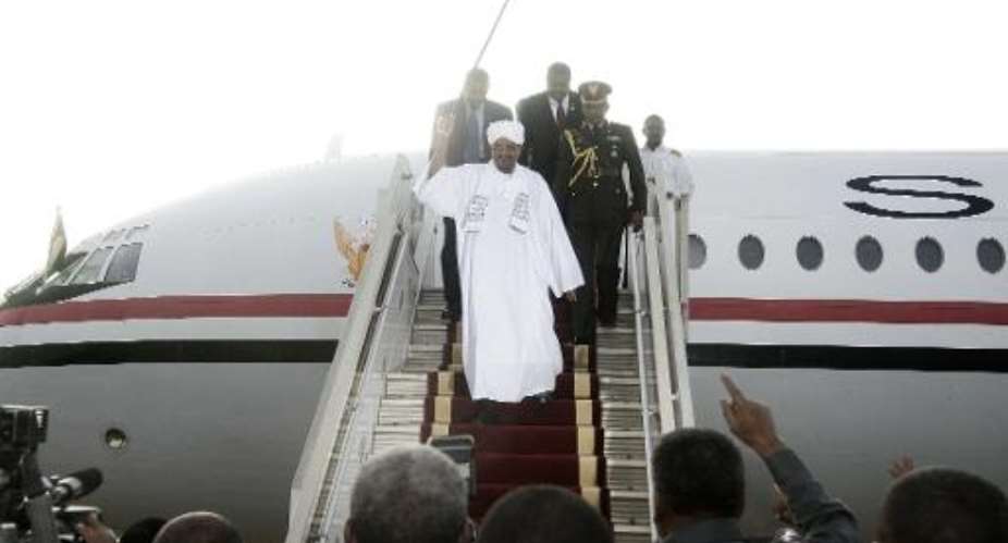Sudanese President Omar al-Bashir arrives in Khartoum from Johannesburg on June 15, 2015.  By Ebrahim Hamid AFP