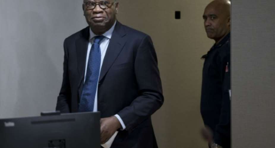 Former Ivory Coast president Laurent Gbagbo arrives for the start of his trial at the International Criminal Court in The Hague on January 28, 2016.  By Peter Dejong PoolAFPFile