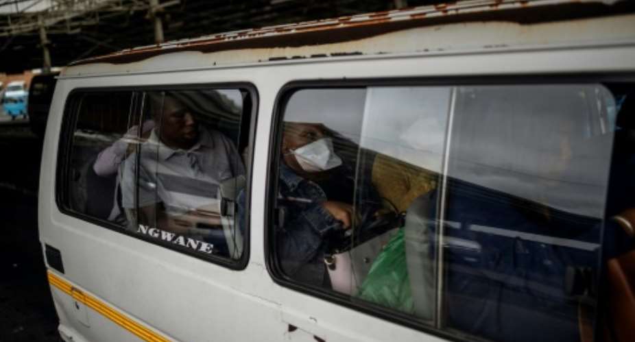 Crammed: A quarter of South Africa's population depends on minibus taxis to get to work or school.  By Michele Spatari AFP