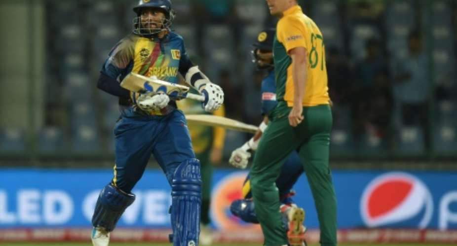 Sri Lanka's Tillakaratne Dilshan L runs between the wickets past South Africa bowler Kyle Abbott during the World T20 match at The Feroz Shah Kotla Cricket Stadium in New Delhi on March 28, 2016.  By Prakash Singh AFP