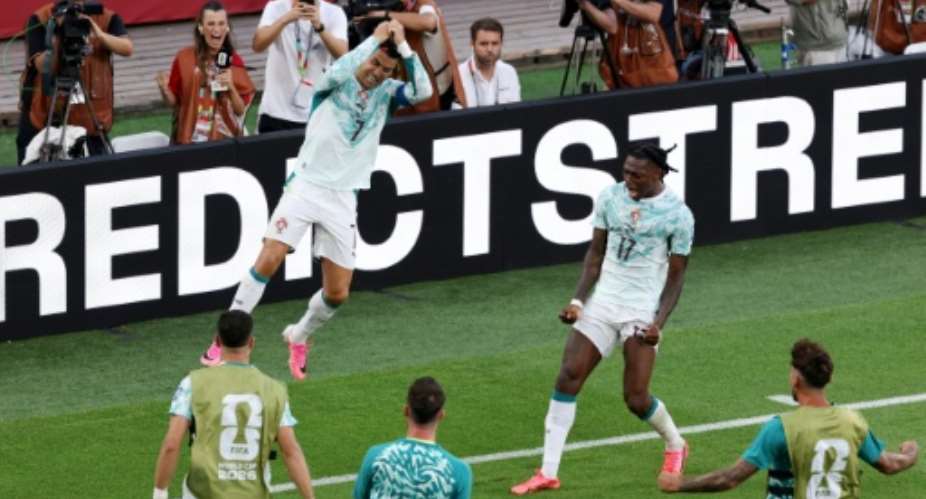 Cristiano Ronaldo celebrates with team-mates after his second-half equaliser in a 2-1 defeat of Croatia.  By Mattia Ozbot (GETTY IMAGES NORTH AMERICA/AFP)
