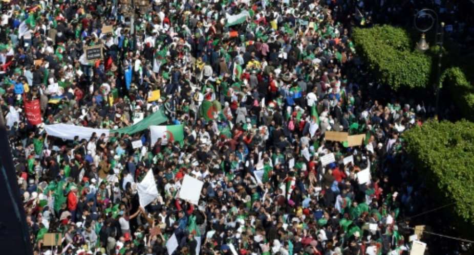 Crowds of demonstrators flooded the streets of the Algerian capital for the fourth consecutive Friday.  By RYAD KRAMDI AFP