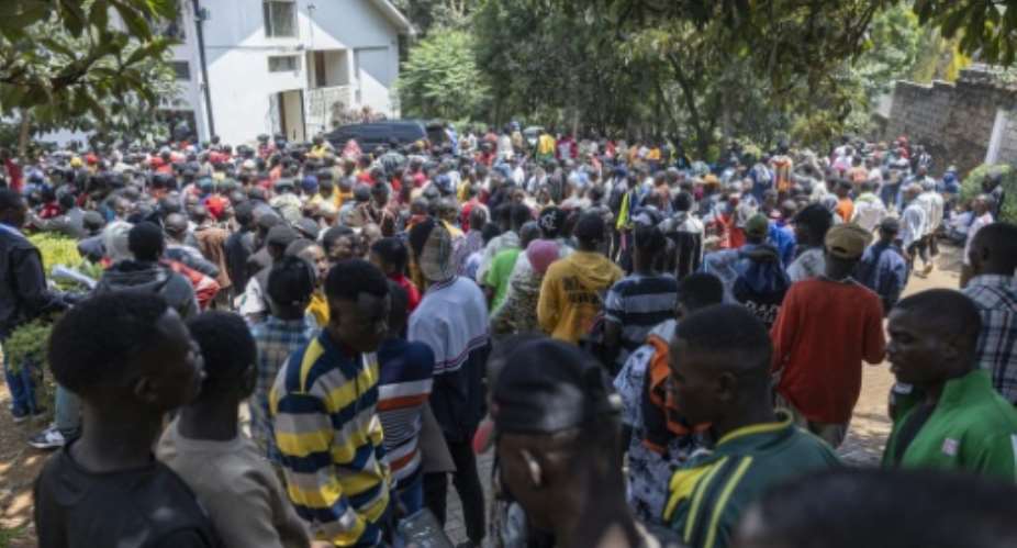 Crowds queued outside the Burundi embassy on Monday.  By SIMON MAINA (AFP)