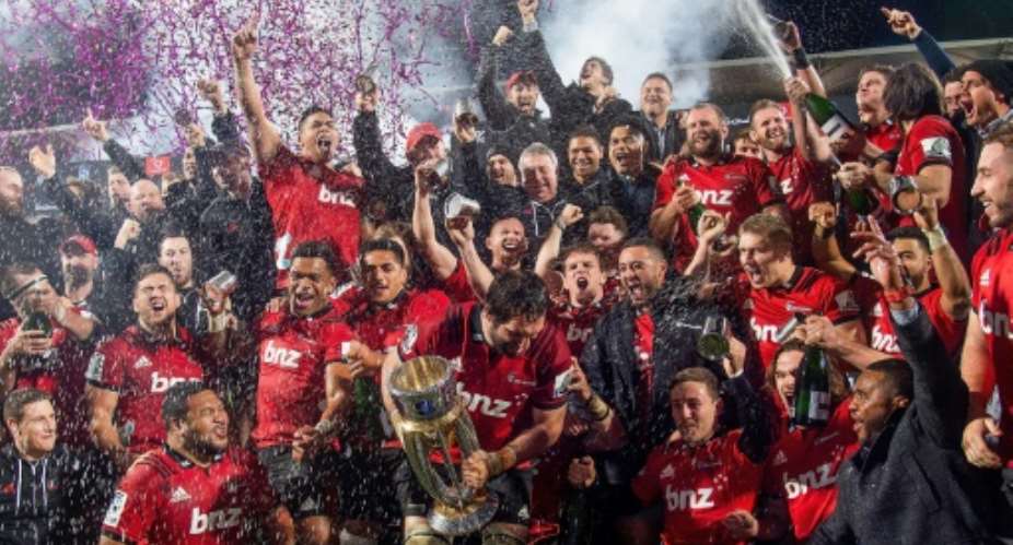 Crusaders celebrate after their second consecutive Super Rugby title win.  By Marty MELVILLE AFP