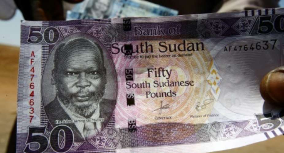 Currency slide: The Sudanese pound.  By ASHRAF SHAZLY AFP
