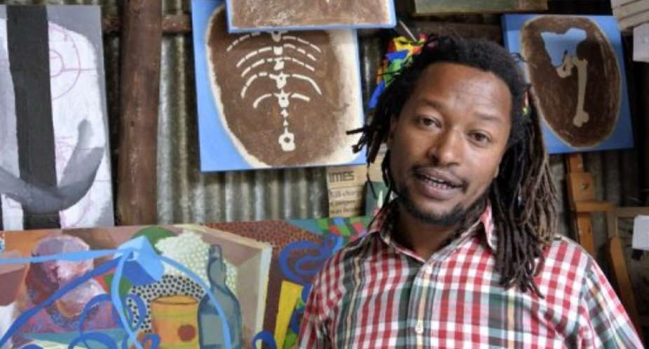 Artist Tamrat Gazahegn and his paintings at the Netsa Art Village in Addis Ababa, Ethiopia, on February 22, 2013.  By Jenny Vaughan (AFP/File)