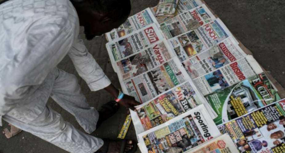 Daily newspapers in Lagos closely follow the ups and downs of Nigeria's February 16 presidential and legislative elections in what is expected to be a close race.  By STEFAN HEUNIS AFP