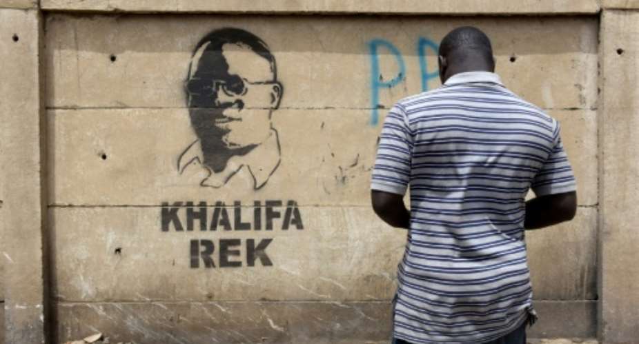 Dakar Mayor Khalifa Sall's five-year term for fraudulent use of public funds has been upheld by a Senegalese court. This graffiti image of the highly popular figure bears the words 'Khalifa Rek' - 'Only Khalifa'.  By SEYLLOU AFPFile