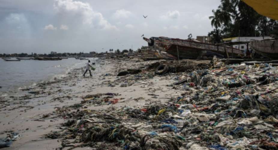 Dakar's Hann Bay is strewn with plastic rubbish.  By JOHN WESSELS AFP
