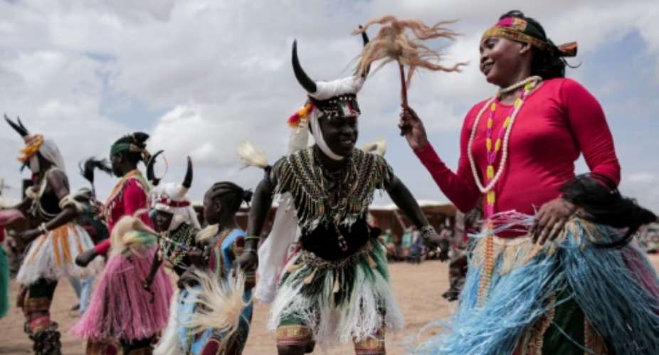 Dancers from the Nuba Mountains of Sudans South Kordofan region celebrate at a festival in 2019; the region was devastated by decades of war, but now only holdout rebels remain in isolated enclaves.  By Jean Marc MOJON (AFP)