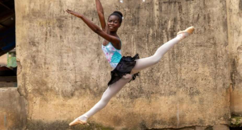 Dancing in the streets: A ballet student of the Leap of Dance Academy in a poor district of Nigerian megacity Lagos.  By Benson Ibeabuchi AFP