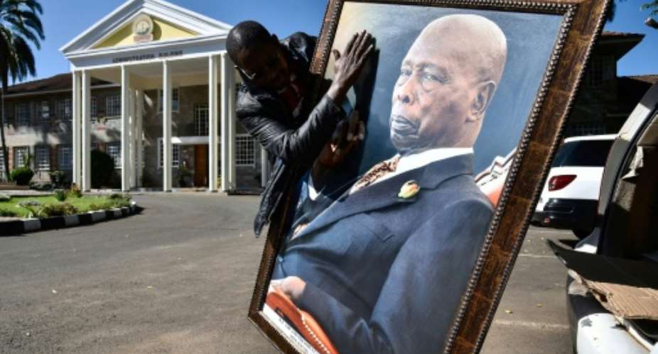 Daniel arap Moi, who towered over Kenya between 1978 and 2002, lay in state for three days in parliament, with tens of thousands of people filing past to pay their respects.  By SULEIMAN MBATIAH AFPFile