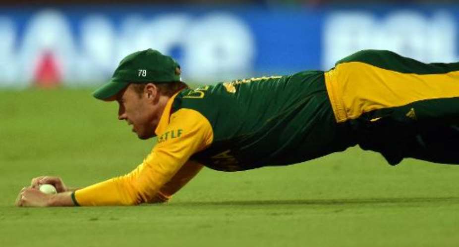 South Africa's captain AB de Villiers takes a catch during their 2015 Cricket World Cup Pool B match against the West Indies at the Sydney Cricket Ground on February 27, 2015 in Australia.  By Saeed Khan AFP