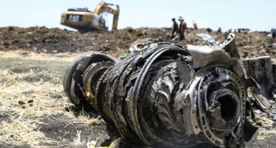 Debris of the Boeing 737 MAX 8 plane strewn over a crash site outside Addis Ababa.  By Michael TEWELDE AFP