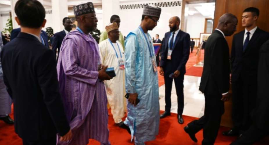 Delegates arrive for the opening ceremony of the Forum on China-Africa Cooperation in Beijing€s Great Hall of the People.  By GREG BAKER (POOL/AFP)