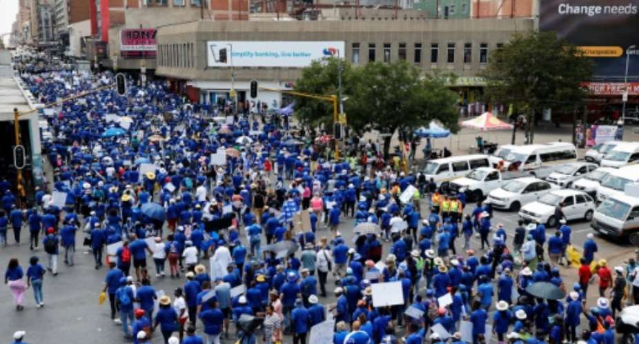Democratic Alliance DA members marching toward the headquarters of the African National Congress ANC party in Johannesburg.  By PHILL MAGAKOE AFP