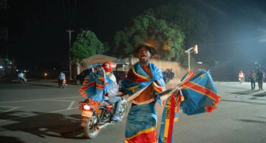 Democratic Republic of Congo fans set aside fears over the Ebola epidemic and celebrated their sides historic World Cup draw with Portugal.  By Jospin Mwisha (AFP)