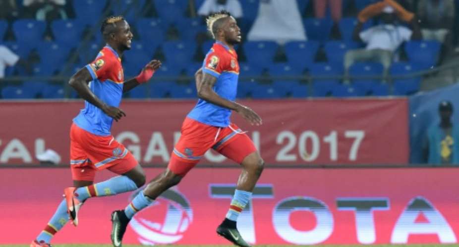 Democratic Republic of the Congo's forward Junior Kabananga R celebrates with midfielder Merveille Bokadi after scoring a goal on January 16, 2017.  By ISSOUF SANOGO AFP