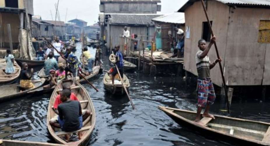 People navigate through the waterways of the Makoko slum in Lagos, in 2011.  By Pius Utomi Ekpei (AFP/File)
