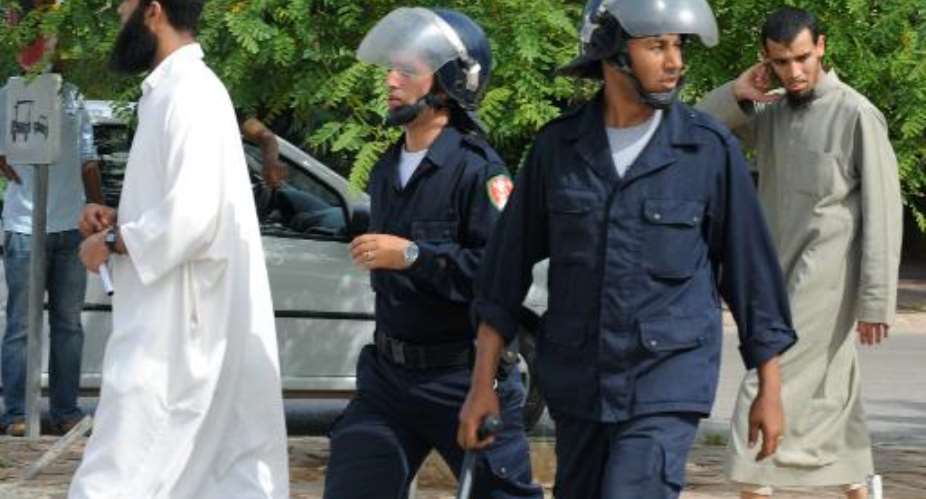 Police officers patrol during a rally in Rabat, Morrocco, on May 15, 2011.  By Abdelhak Senna AFPFile