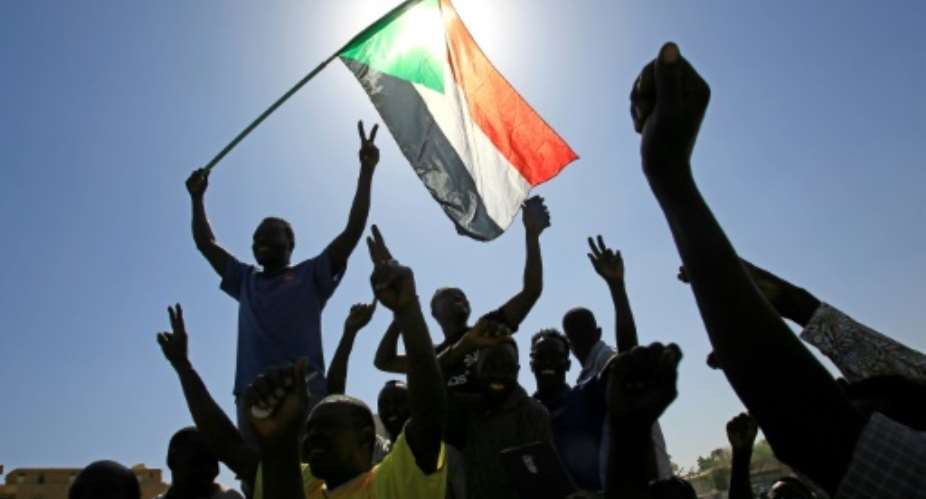 Demonstrators from Sudan's Nuba peoples march in the capital Khartoum on Wednesday to protest against recent deadly inter-ethnic violence in their southern home region.  By ASHRAF SHAZLY AFP