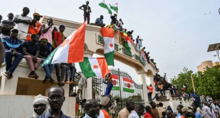 Demonstrators in Nigers capital Niamey chanted slogans hostile to former colonial power France and West African regional bloc ECOWAS.  By - (AFP)