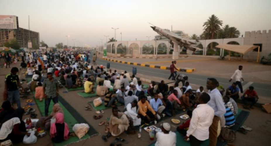 Demonstrators remain camped out in the soaring heat of Khartoum calling for civilian rule three weeks after the military ousted veteran leader Omar al-Bashir.  By MOHAMED EL-SHAHED AFPFile