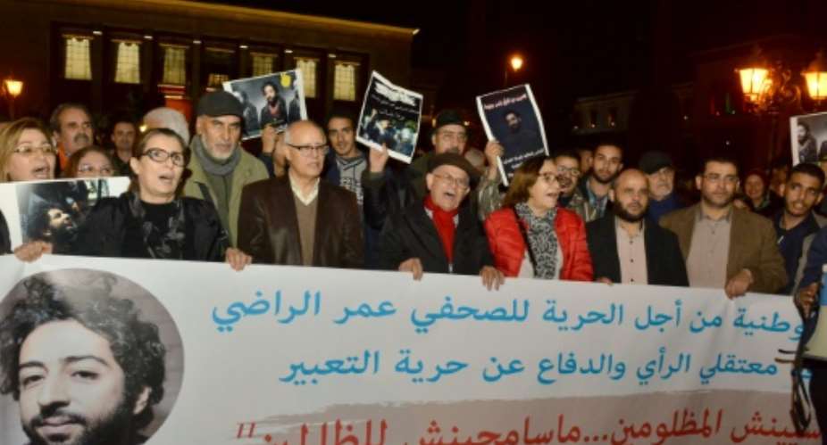 Demonstrators shout slogans during a protest in support of Omar Radi, a Moroccan journalist detained over tweet criticising a judge, on December 28, 2019, in the city of Rabat.  By STR AFPFile