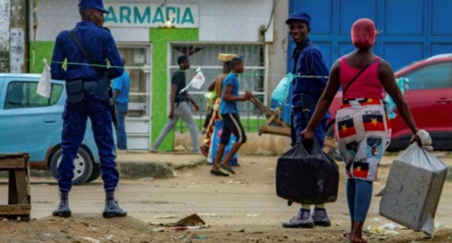 Despite the restrictions, many Angolans view earning money, finding food and fetching water as legitimate reasons to leave home.  By Osvaldo Silva AFP