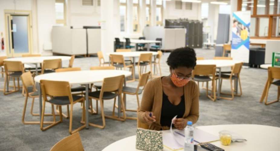 Despite virus restrictions, Agnes Genoveva Cheba Ade says being able to study at Coventry University is something to cherish every day.  By OLI SCARFF AFP